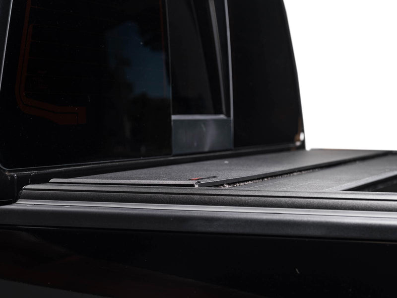 Pace Edwards UltraGroove Electric: low side view of a closed matte black cover and rail meeting a black cab