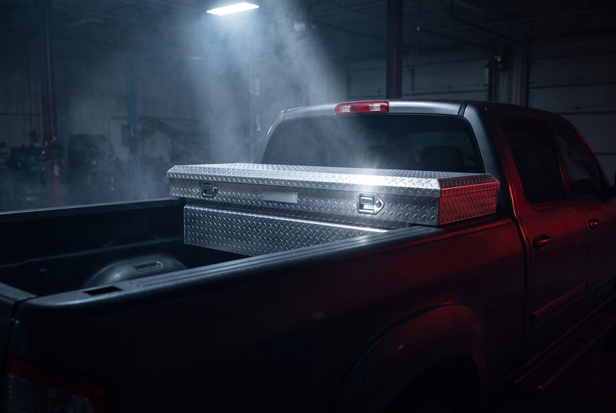 Crossover truck tool box mounted in a pickup bed