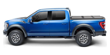 Blue 2022 Ford F-150 with an Extang Solid Fold ALX hard folding tonneau cover