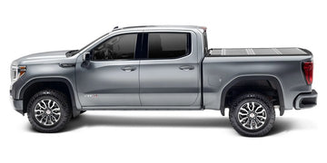 Gray 2019 GMC Sierra 1500 with a BAKFlip G2 hard folding tonneau cover
