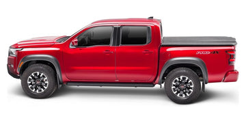 Red 2022 Nissan Frontier with an UnderCover Elite one-piece tonneau cover