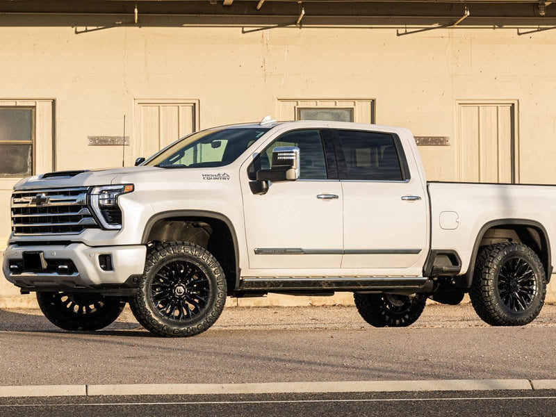 ReadyLIFT 2" Front Leveling Kit With Forged Torsion Keys, on a leveled white Chevrolet Silverado HD