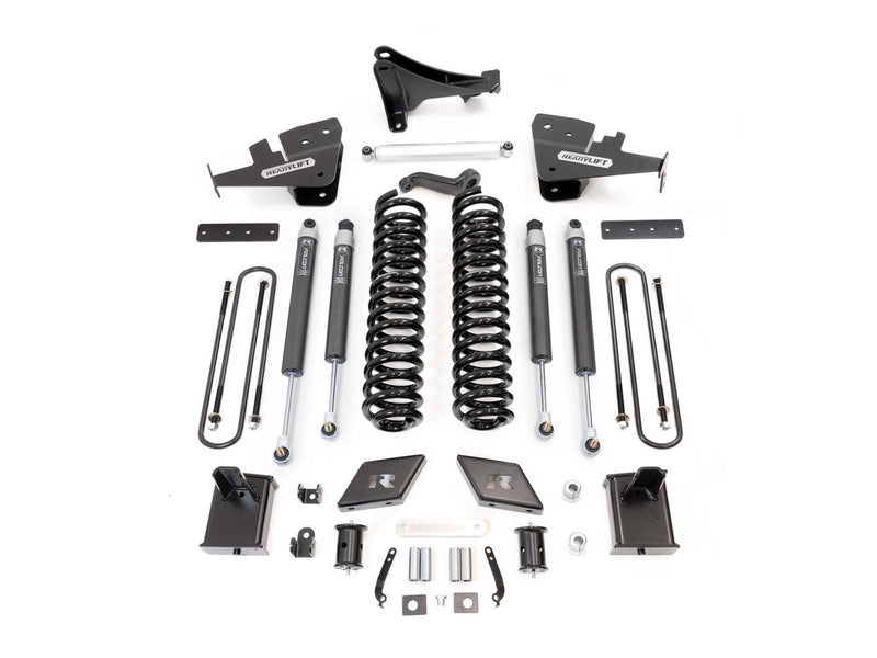ReadyLIFT lift kit laid out on white: front coil springs, brackets, shocks, blocks and U-bolts