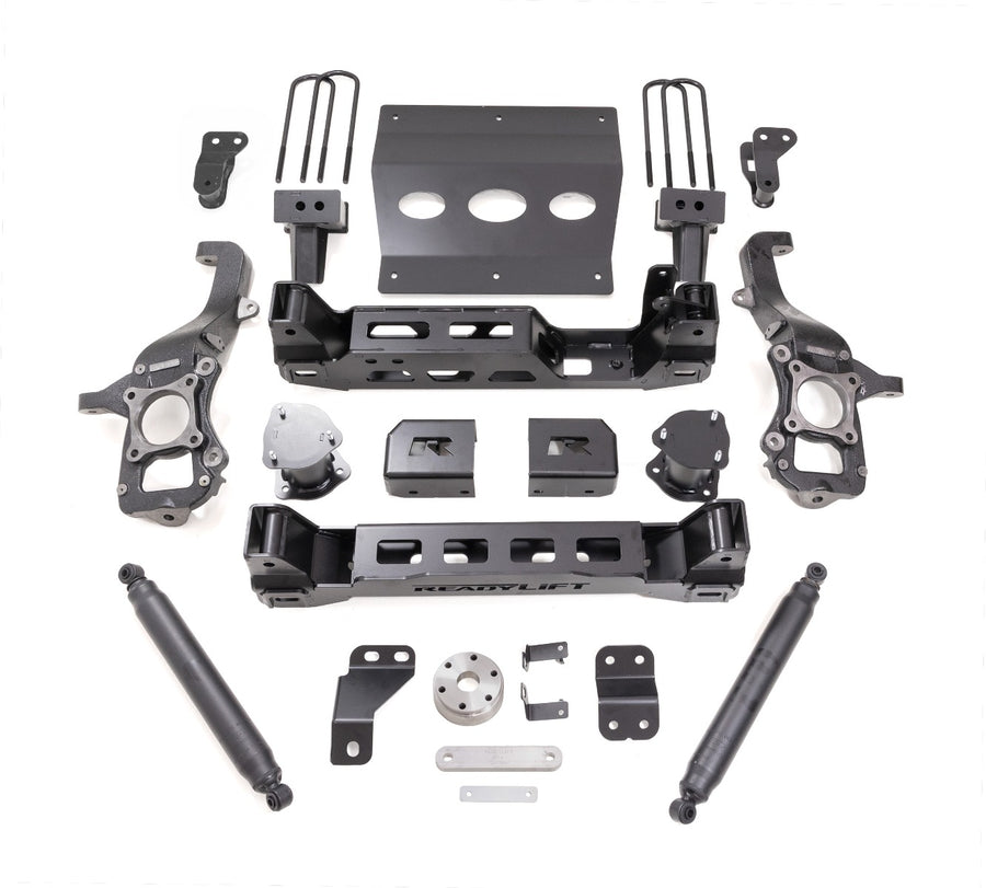 ReadyLIFT Big Lift Kit, full kit on a studio background: ReadyLIFT 6" F-150 kit with knuckles, crossmembers, skid plate, blocks, U-bolts and two black rear shocks on white