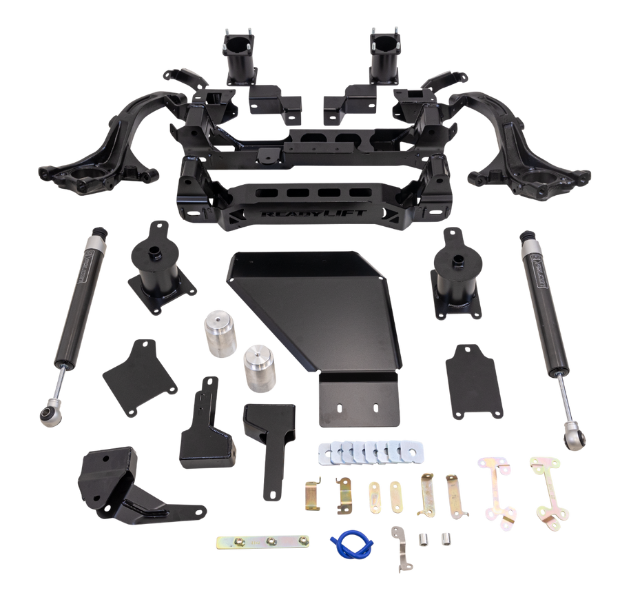 ReadyLIFT Big Lift Kit, full kit on a studio background: ReadyLIFT Tundra kit with knuckles, crossmember, skid plate, spacers, shocks and hardware on a black background, no rear coils
