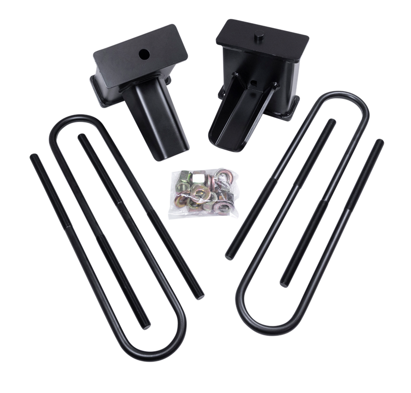 ReadyLIFT Block Kit, full kit on a studio background: two black 5" tapered rear lift blocks with four long black U-bolts and a bag of hardware on a black background