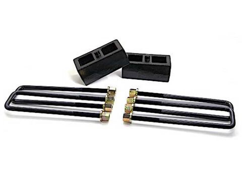 ReadyLIFT Block Kit, full kit on a studio background: two black cast rear lift blocks with four long square U-bolts and gold nuts on white