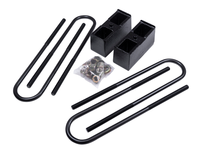 ReadyLIFT Block Kit, full kit on a studio background: two black rear blocks with U-bolts and bagged hardware on a black background