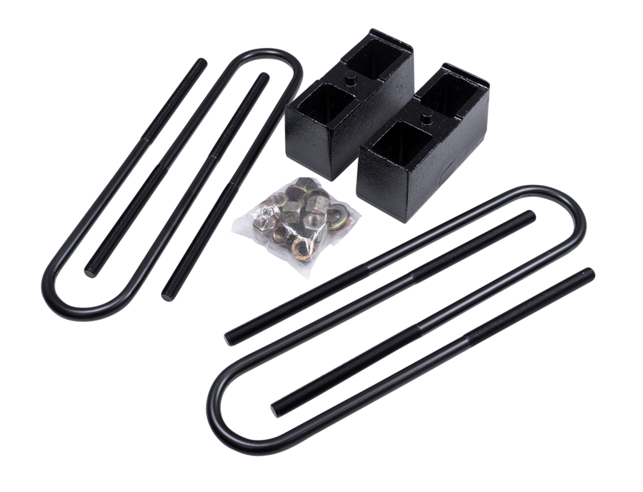 ReadyLIFT Block Kit, full kit on a studio background: two black rear blocks with U-bolts and bagged hardware on a black background