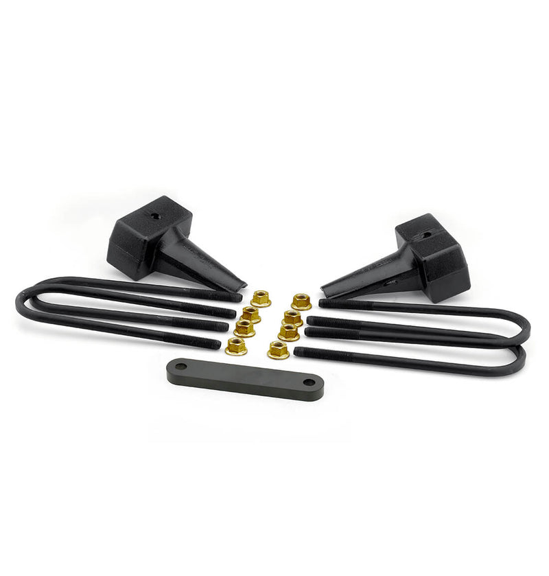 ReadyLIFT Block Kit, full kit on a studio background: two black tapered rear lift blocks with round U-bolts, gold nuts and a flat spacer plate on white