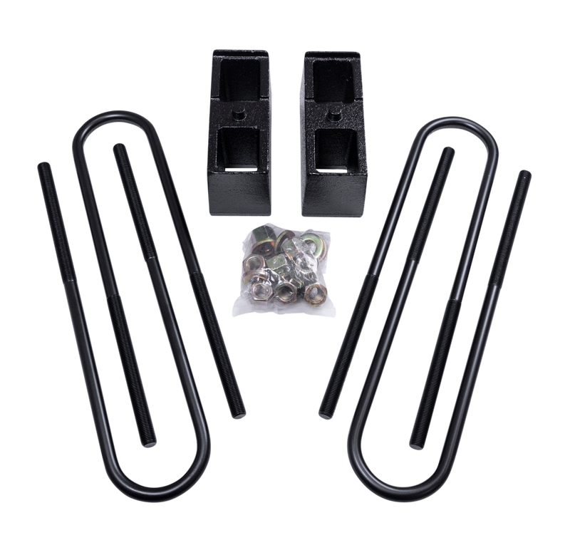 ReadyLIFT Block Kit, full kit on a studio background: two tall black rear blocks with U-bolts and bagged hardware on a black background