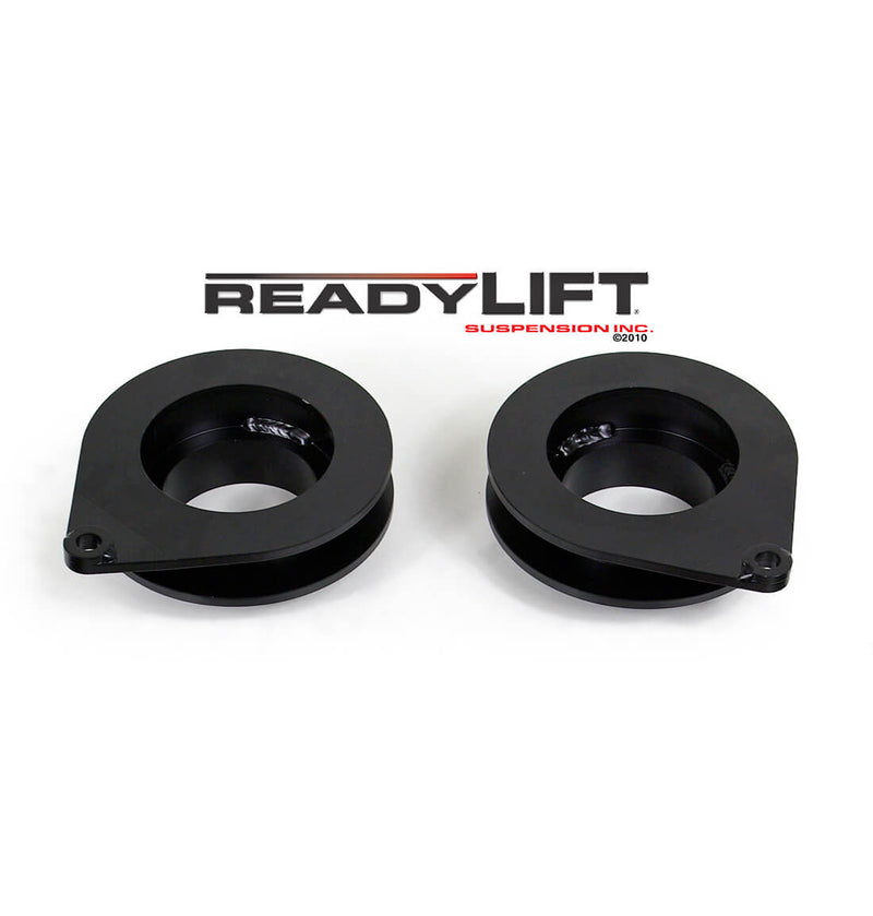 ReadyLIFT Coil Spacer, full kit on a studio background: two black rear coil spring spacers with locating tabs under a ReadyLIFT logo