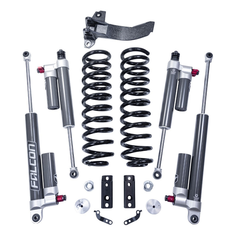 ReadyLIFT Coil Spring Front Lift Kit, full kit on a studio background: coil springs, track bar bracket, four Falcon 3.3 reservoir shocks and spacers on white