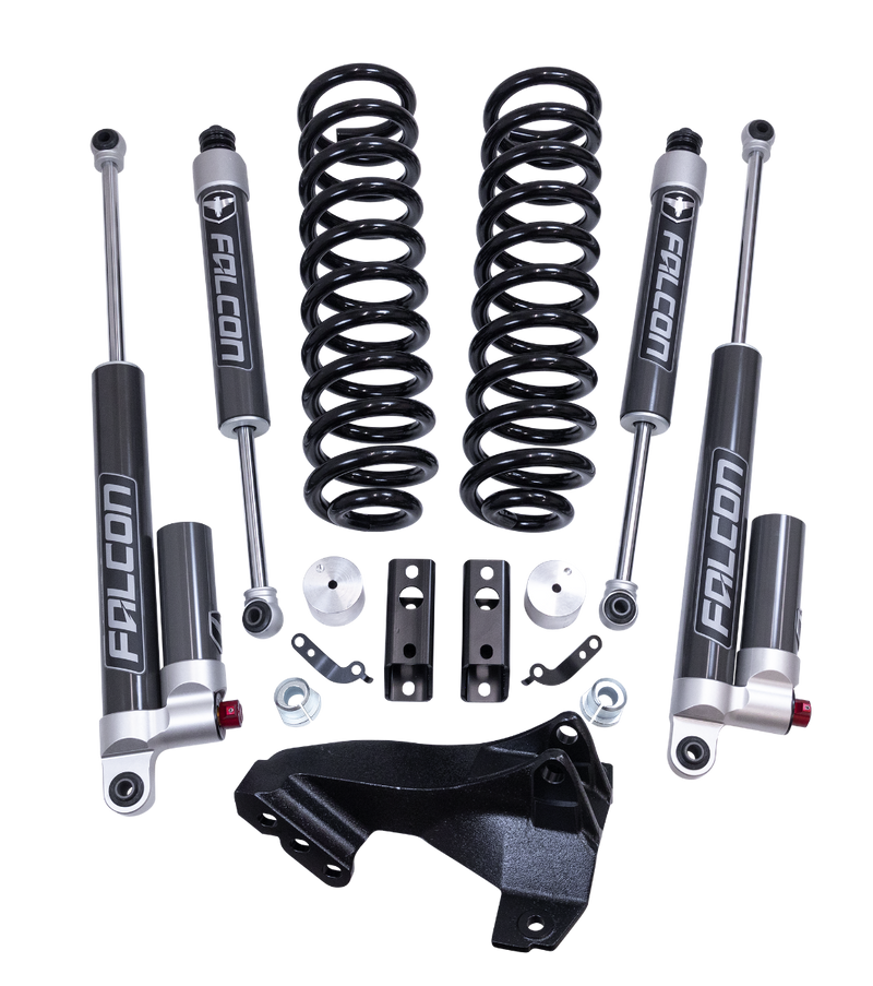ReadyLIFT Coil Spring Front Lift Kit, full kit on a studio background: coil springs, track bar bracket, two Falcon 2.1 shocks, two Falcon reservoir shocks and spacers on a black background