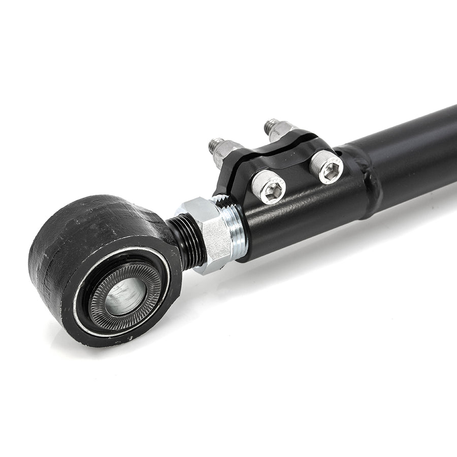 Close-up of the ReadyLIFT Front Track Bar: close-up of a black track bar end with bushing and clamp bolts on white