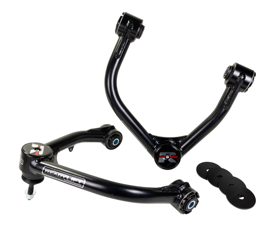 ReadyLIFT Leveling and Big Lift Upper Control Arms, full kit on a studio background: two black ReadyLIFT tubular upper control arms with red R caps and black washers on white