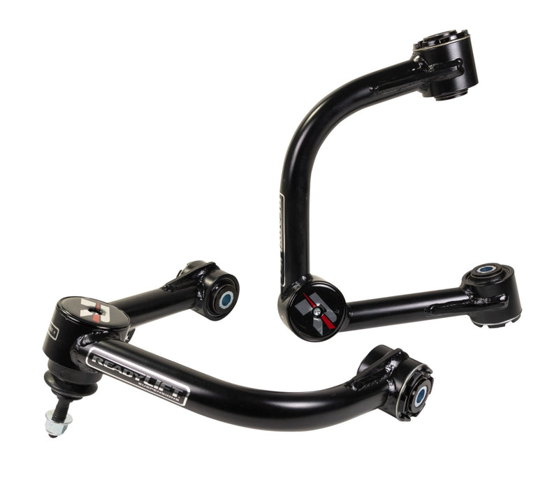 ReadyLIFT Leveling and Big Lift Upper Control Arms, full kit on a studio background: two black ReadyLIFT tubular upper control arms with red R caps on a white background