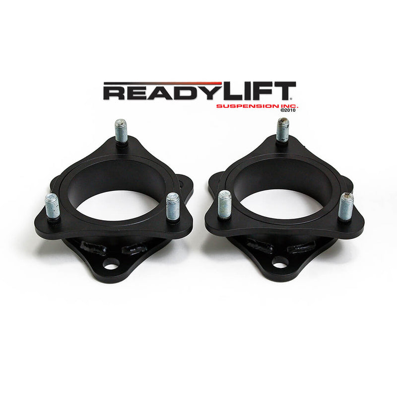ReadyLIFT Leveling Kit, full kit on a studio background: pair of black strut spacers with studs under a ReadyLIFT logo on white