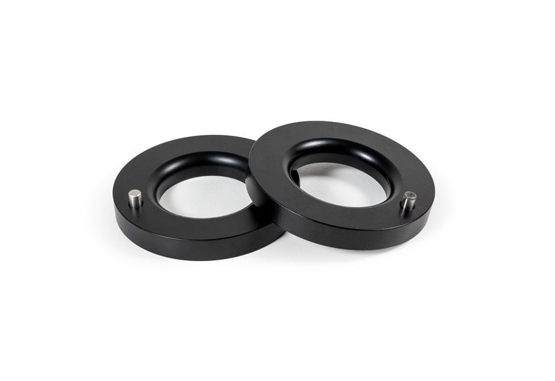 ReadyLIFT Leveling Kit, full kit on a studio background: pair of thin black pre-load spacer rings with locating pins on white