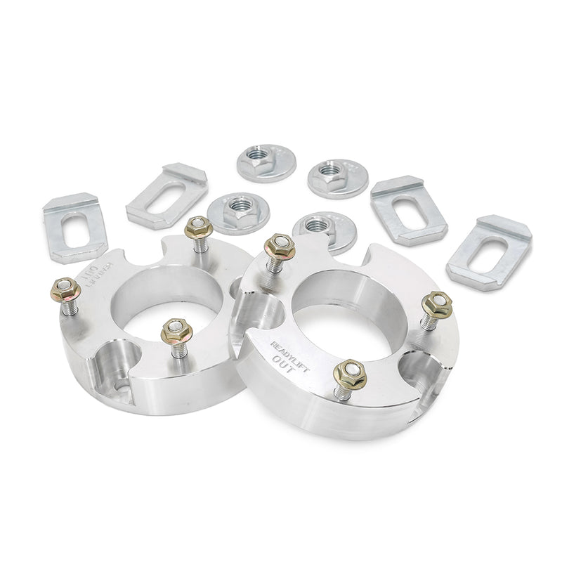 ReadyLIFT Leveling Kit, full kit on a studio background: two aluminum strut spacers with nuts and alignment tabs on white
