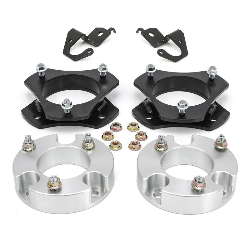ReadyLIFT Lift Kit, full kit on a studio background: two black strut spacers, two aluminum spacers, two brackets and nuts on white