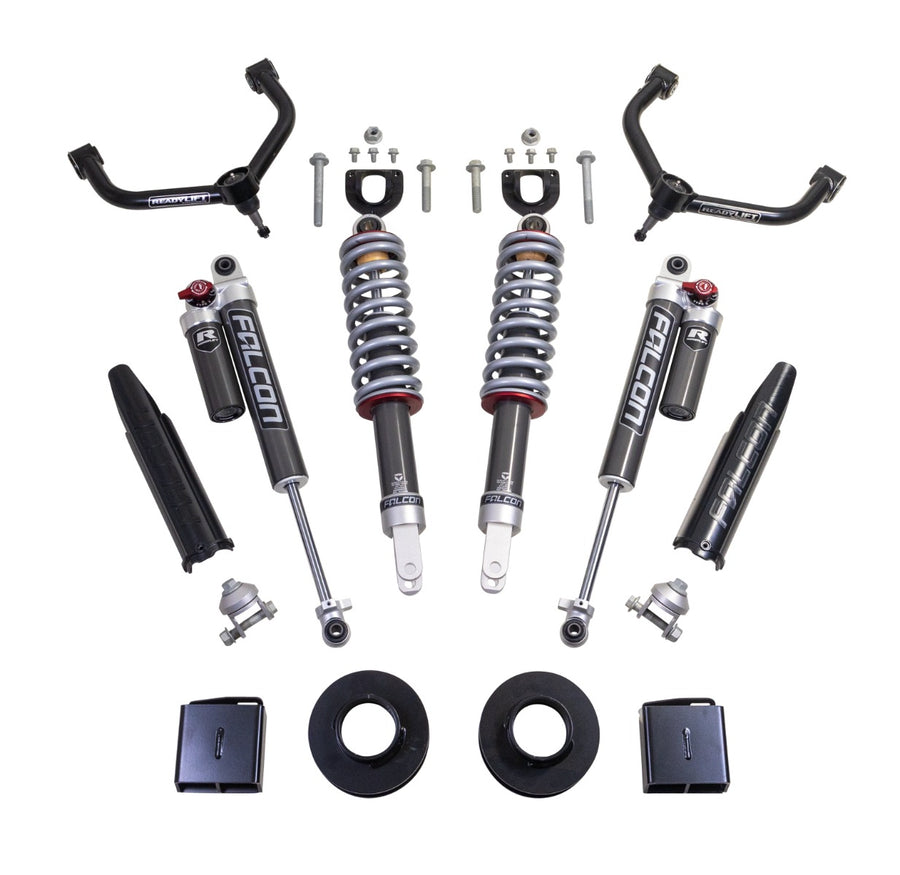ReadyLIFT Lift Kit, full kit on a studio background: two black upper control arms, two Falcon coilovers, two Falcon rear shocks with reservoirs, spacers and brackets on white