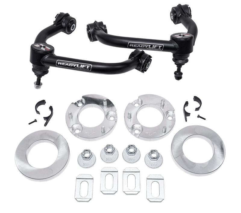 ReadyLIFT Lift Kit, full kit on a studio background: two ReadyLIFT upper control arms with aluminum spacers, rings, nuts and tabs on a black background