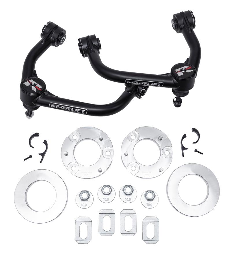 ReadyLIFT Lift Kit, full kit on a studio background: two ReadyLIFT upper control arms with aluminum spacers, rings, nuts and tabs on a black background