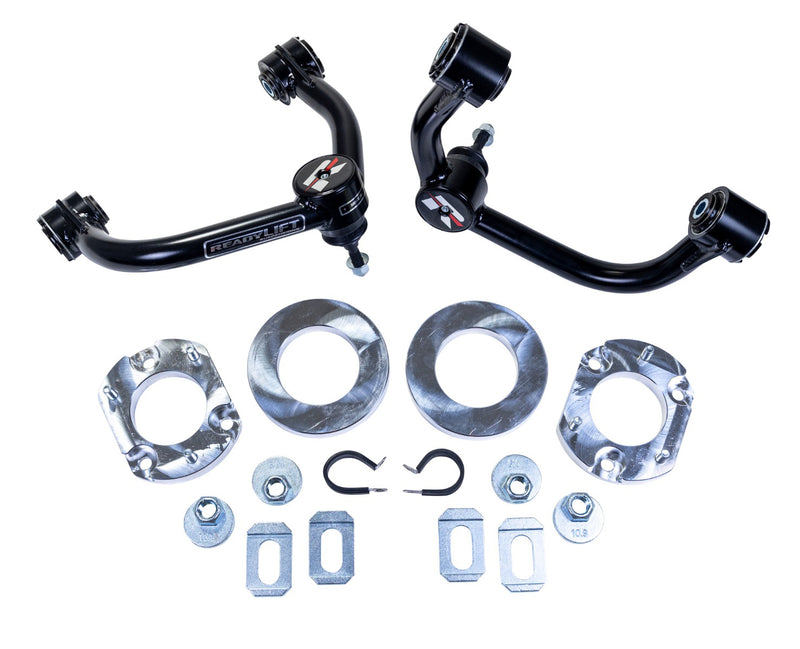 ReadyLIFT Lift Kit, full kit on a studio background: two ReadyLIFT upper control arms with aluminum spacers, rings, nuts and tabs on white