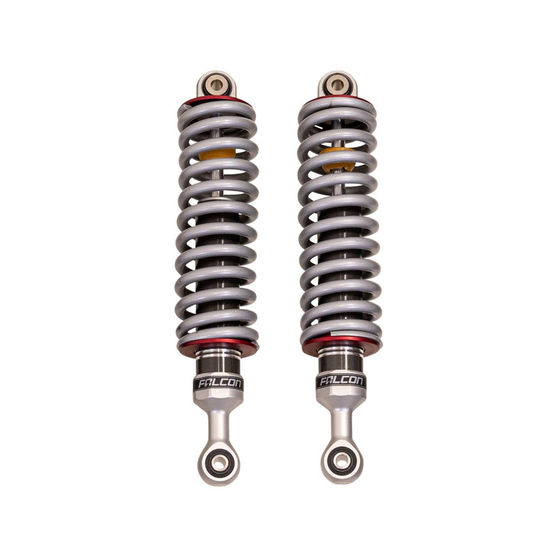 ReadyLIFT Premium Falcon 2.1 Standalone Front Pair, full kit on a studio background: pair of Falcon 2.1 coilovers with gray springs and red collars standing upright on white
