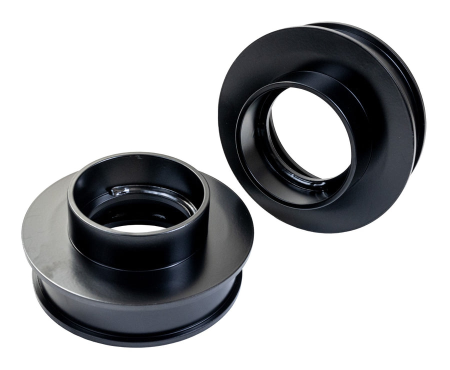 ReadyLIFT Spacer Kit, full kit on a studio background: two black 2" rear coil spring spacers on white