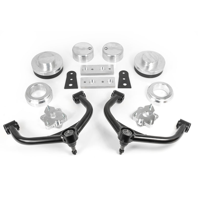 ReadyLIFT SST Lift Kit, full kit on a studio background: aluminum strut and coil spacers, two black upper control arms, brackets and plates laid out on white