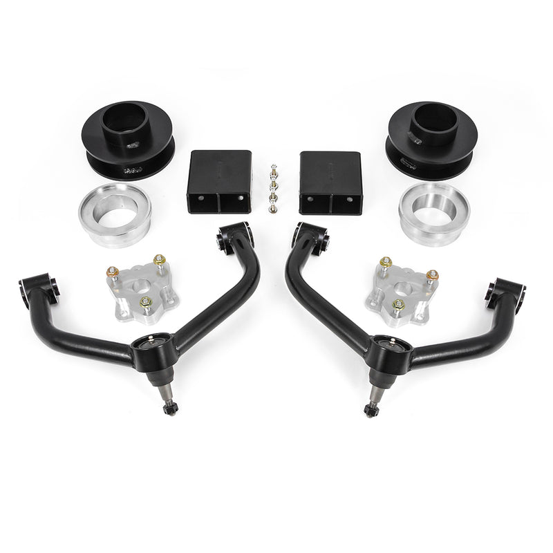 ReadyLIFT SST Lift Kit, full kit on a studio background: black and aluminum spacers, two rear blocks, two black upper control arms and hardware on white