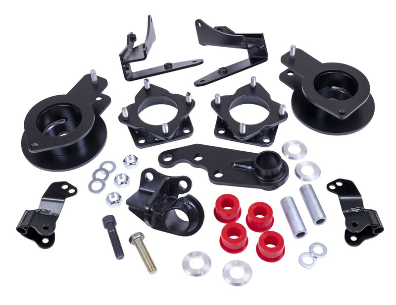 ReadyLIFT SST Lift Kit, full kit on a studio background: black strut spacers, rear spacers, differential drop brackets, red bushings and hardware on white