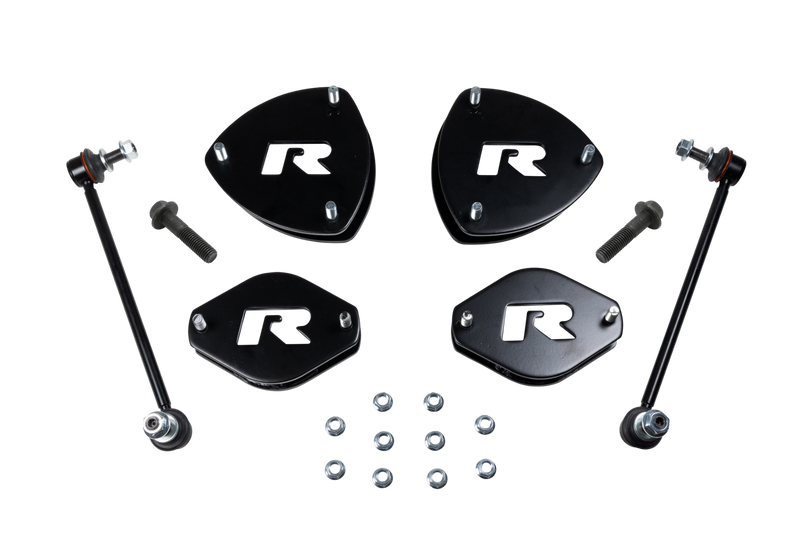 ReadyLIFT SST Lift Kit, full kit on a studio background: four black R strut spacers, two sway bar links, bolts and nuts on a black background
