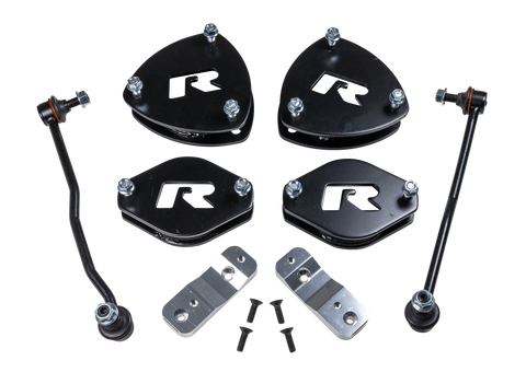 ReadyLIFT SST Lift Kit, full kit on a studio background: four black R strut spacers, two sway bar links, two aluminum brackets and bolts on a black background