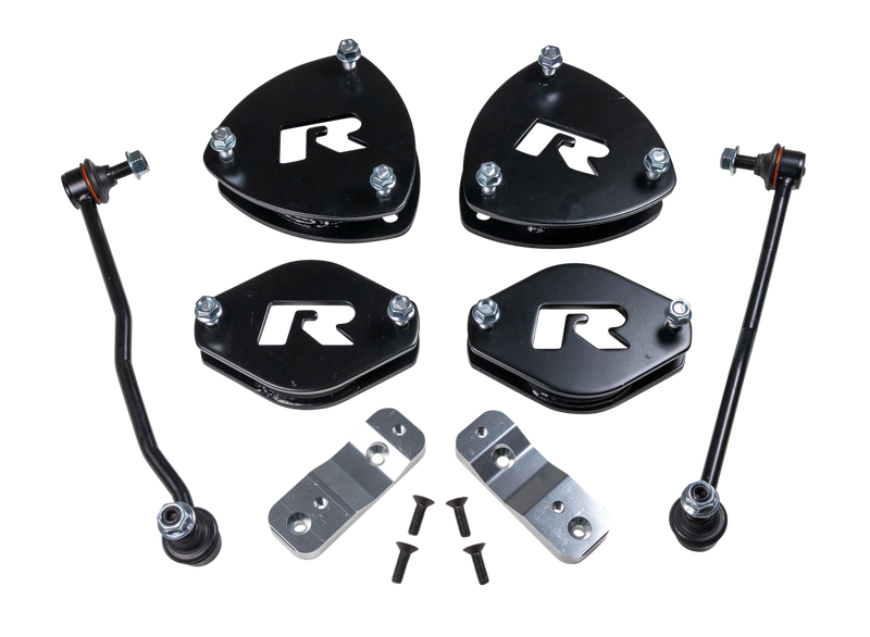 ReadyLIFT SST Lift Kit, full kit on a studio background: four black R strut spacers, two sway bar links, two aluminum brackets and bolts on a black background