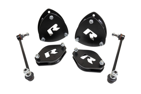 ReadyLIFT SST Lift Kit, full kit on a studio background: four black ReadyLIFT R strut spacers and two sway bar links on white