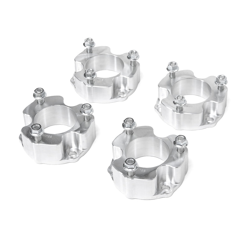 ReadyLIFT SST Lift Kit, full kit on a studio background: four machined aluminum strut spacers with studs and nuts on white