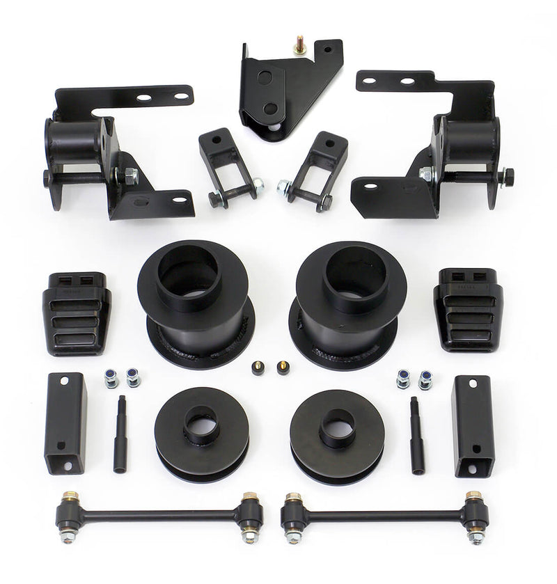 ReadyLIFT SST Lift Kit, full kit on a studio background: track bar and shock brackets, black coil spacers, bump stops, sway bar links and hardware on white