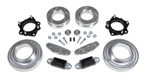 ReadyLIFT SST Lift Kit, full kit on a studio background: two black strut spacers, aluminum coil spacers, aluminum brackets, bump stops and hardware on white