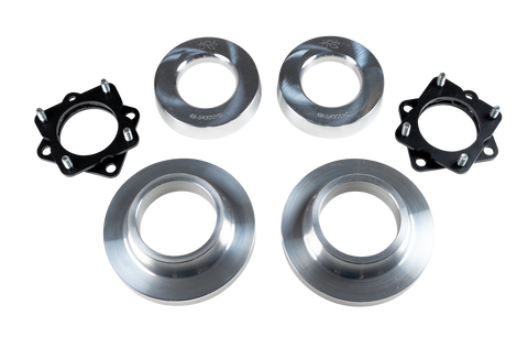 ReadyLIFT SST Lift Kit, full kit on a studio background: two black strut spacers and four aluminum coil spacers on a black-bordered white strip