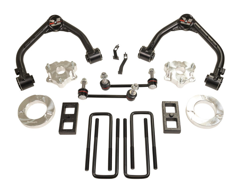ReadyLIFT SST Lift Kit, full kit on a studio background: two black upper control arms, aluminum spacers, sway bar links, rear blocks and U-bolts on white