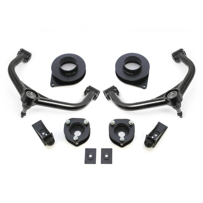 ReadyLIFT SST Lift Kit, full kit on a studio background: two black upper control arms, strut spacers, rear coil spacers, bump stop extensions and plates on white