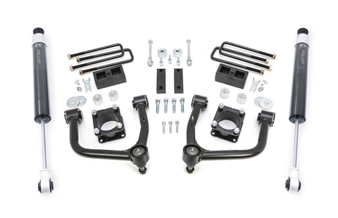 ReadyLIFT SST Lift Kit, full kit on a studio background: two black upper control arms, strut spacers, rear blocks, U-bolts and two gray Falcon rear shocks on white