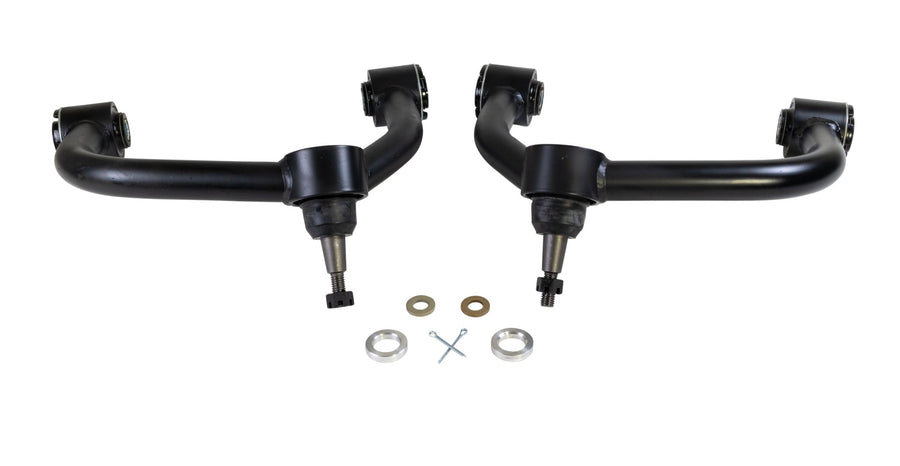 ReadyLIFT SST UCA, full kit on a studio background: A pair of black upper control arms with ball joints and washers on a white background