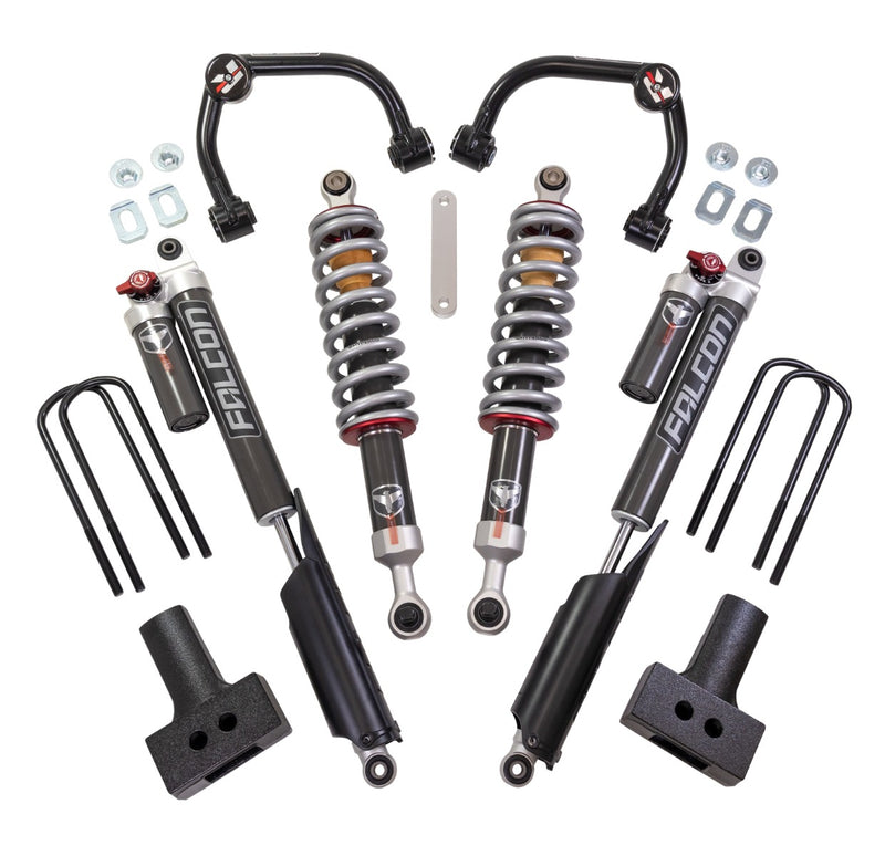 ReadyLIFT SST2.1 Suspension System, full kit on a studio background: two black upper control arms, two Falcon coilovers, two Falcon rear shocks with reservoirs, tapered blocks and U-bolts on white
