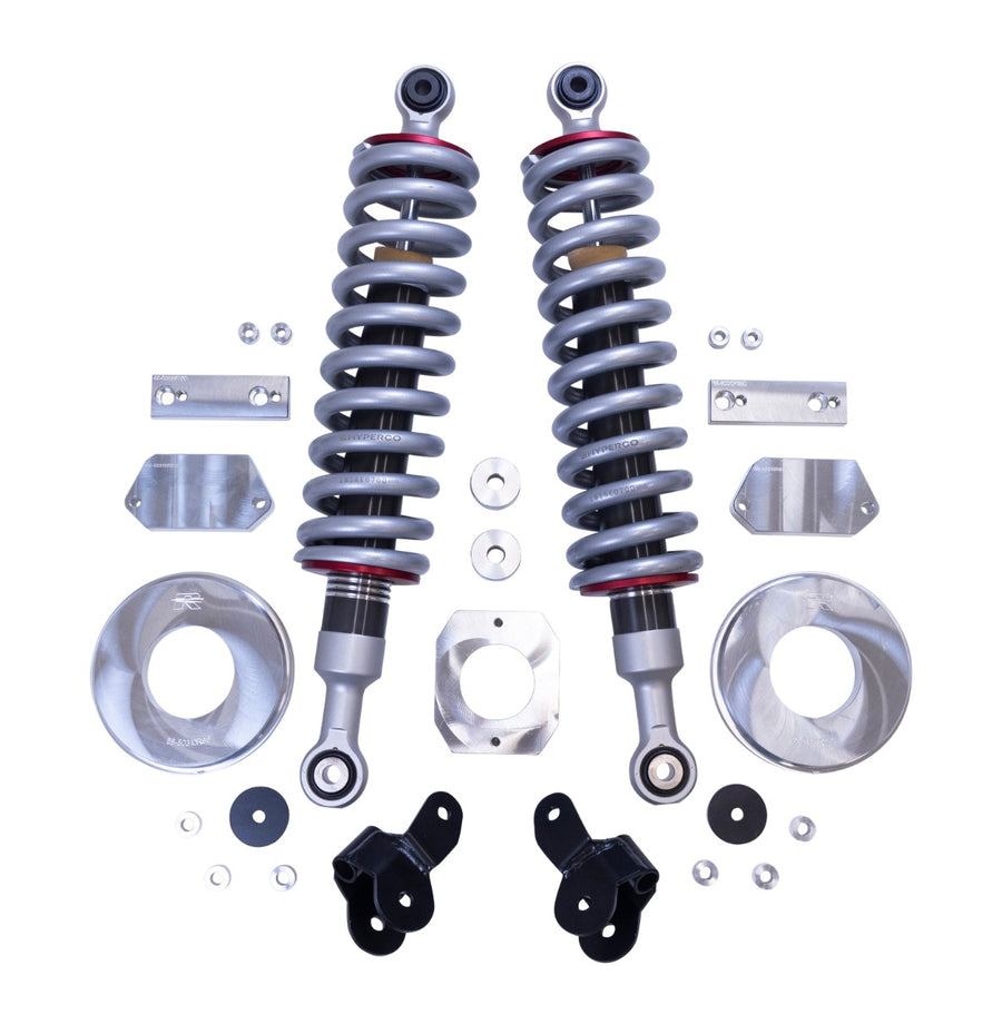 ReadyLIFT SST2.1 Suspension System, full kit on a studio background: two Falcon coilovers with silver springs, aluminum rear spacers, brackets and hardware on white