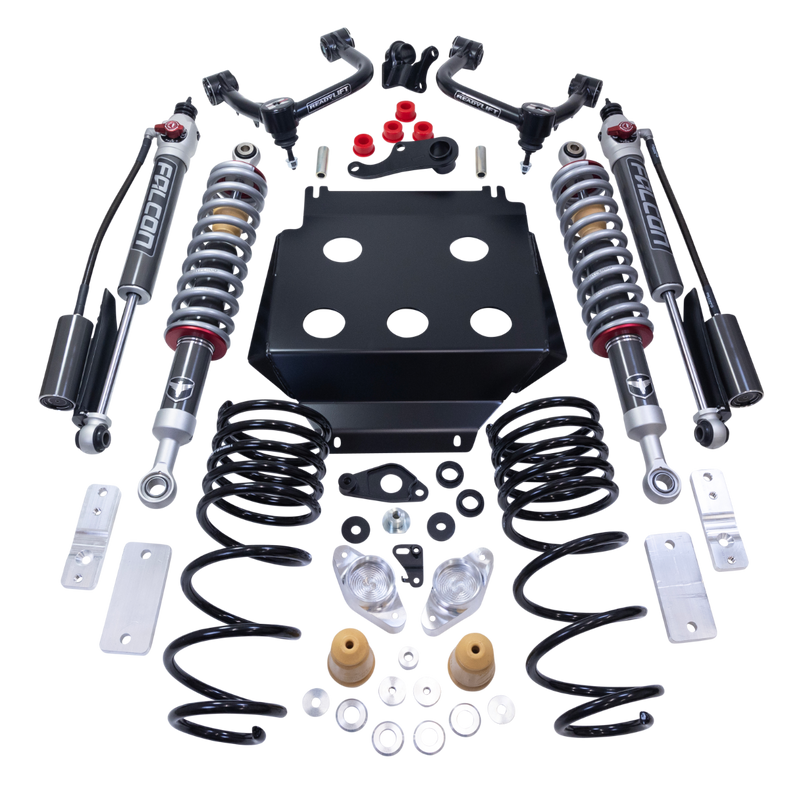 ReadyLIFT SST2.1 Suspension System, full kit on a studio background: two upper control arms, two Falcon coilovers, two rear shocks, rear springs and a skid plate on a black background