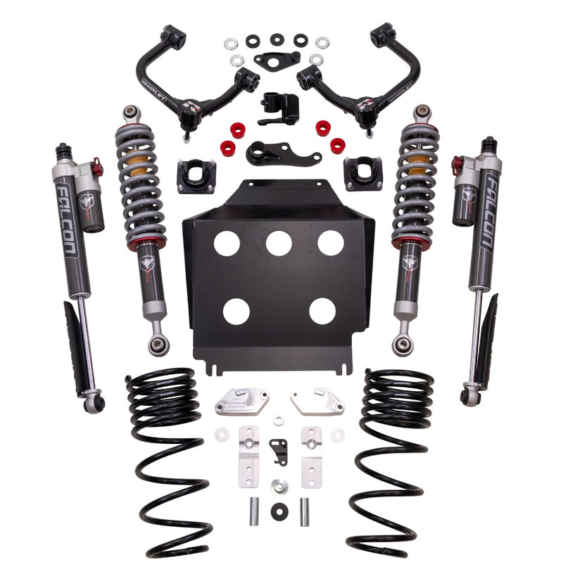 ReadyLIFT SST2.1 Suspension System, full kit on a studio background: two upper control arms, two Falcon coilovers, two rear shocks, rear coil springs and a skid plate on white